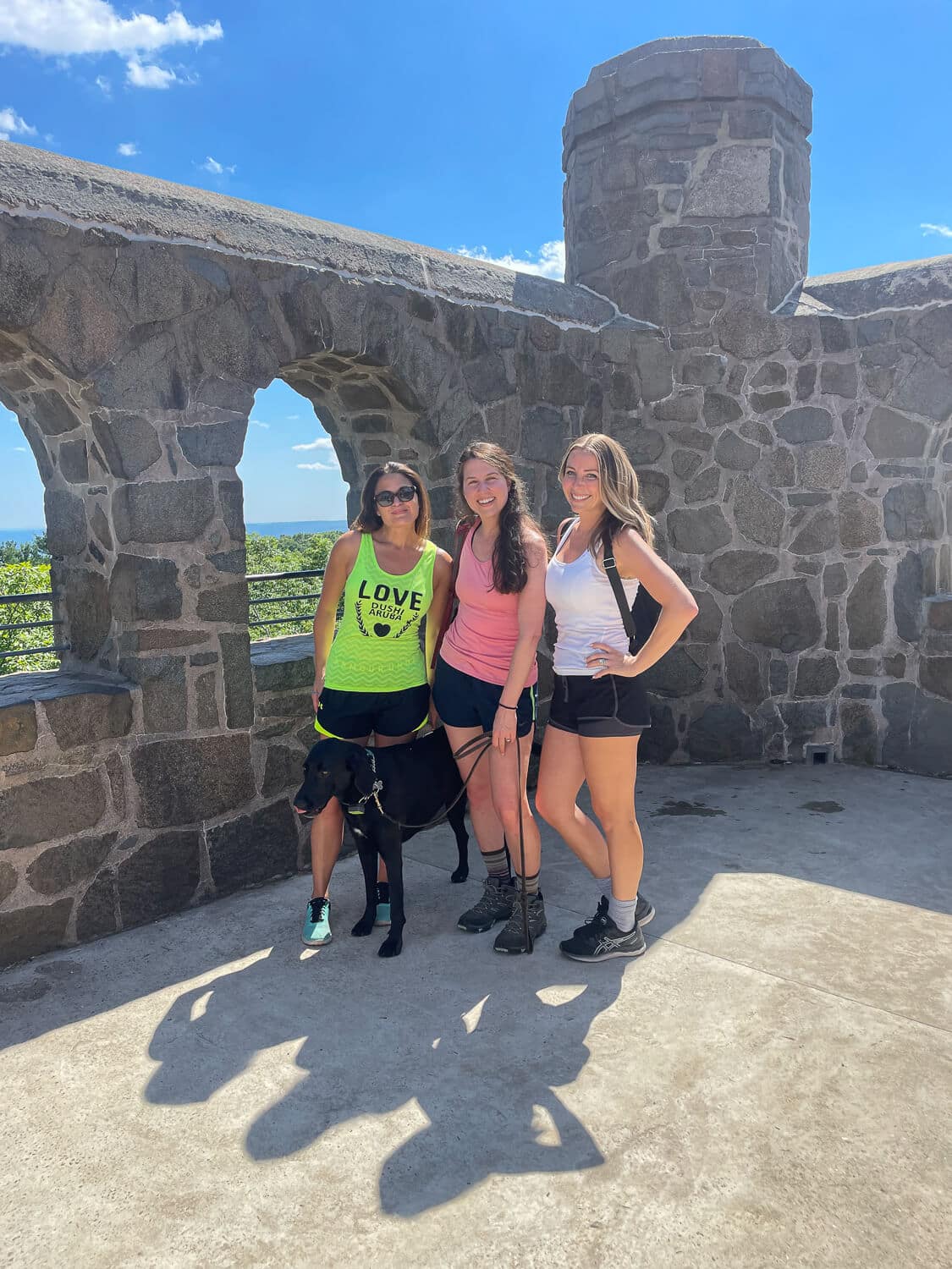 3 friends at top of sleeping giant castle in hamden connecticut