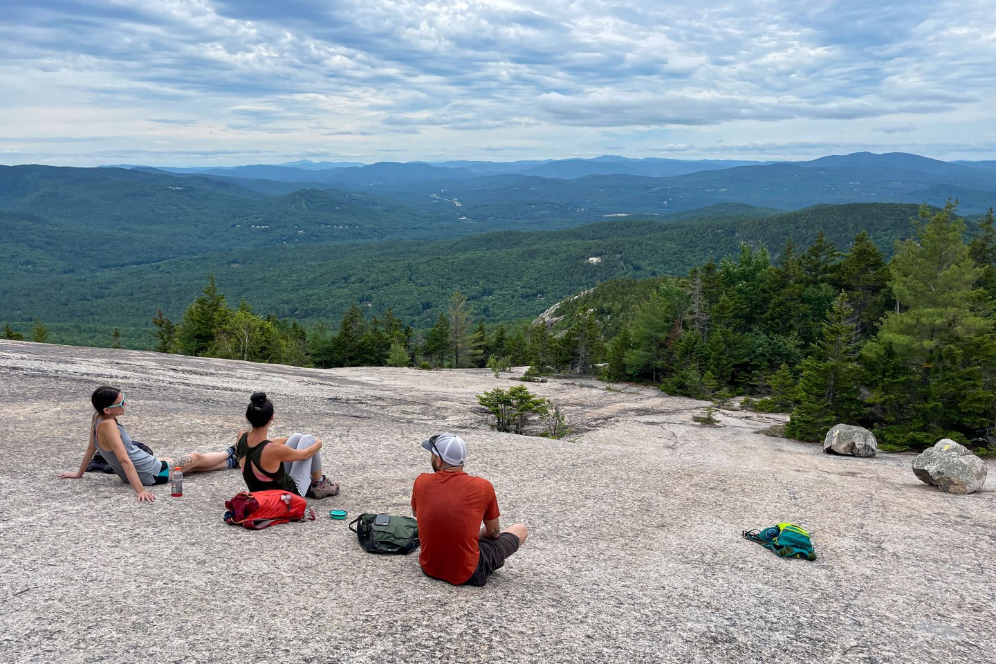 friends on rocky ledge in New Hampshire
