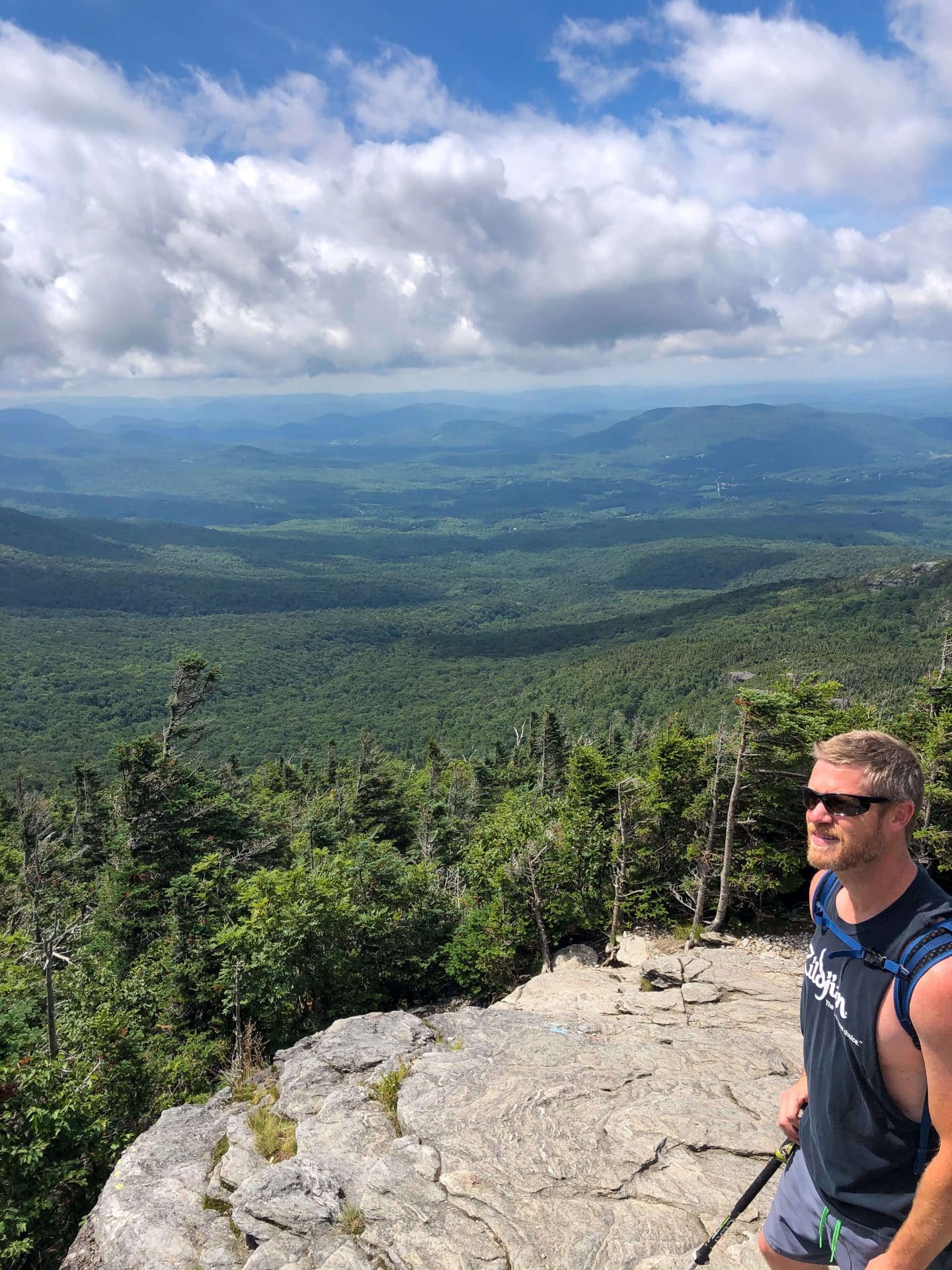 man hiking up mount mansfield trail.