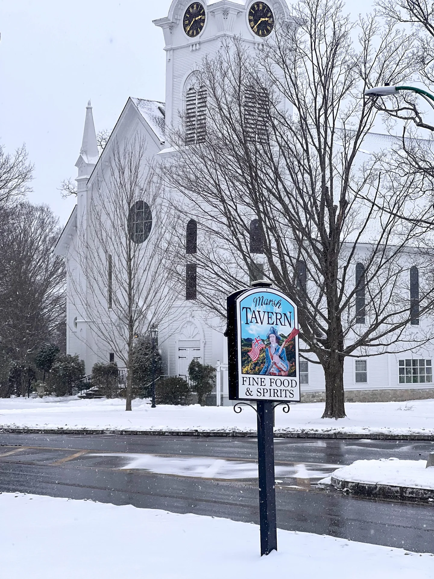 magical new england winter getaway with white church in snowy town