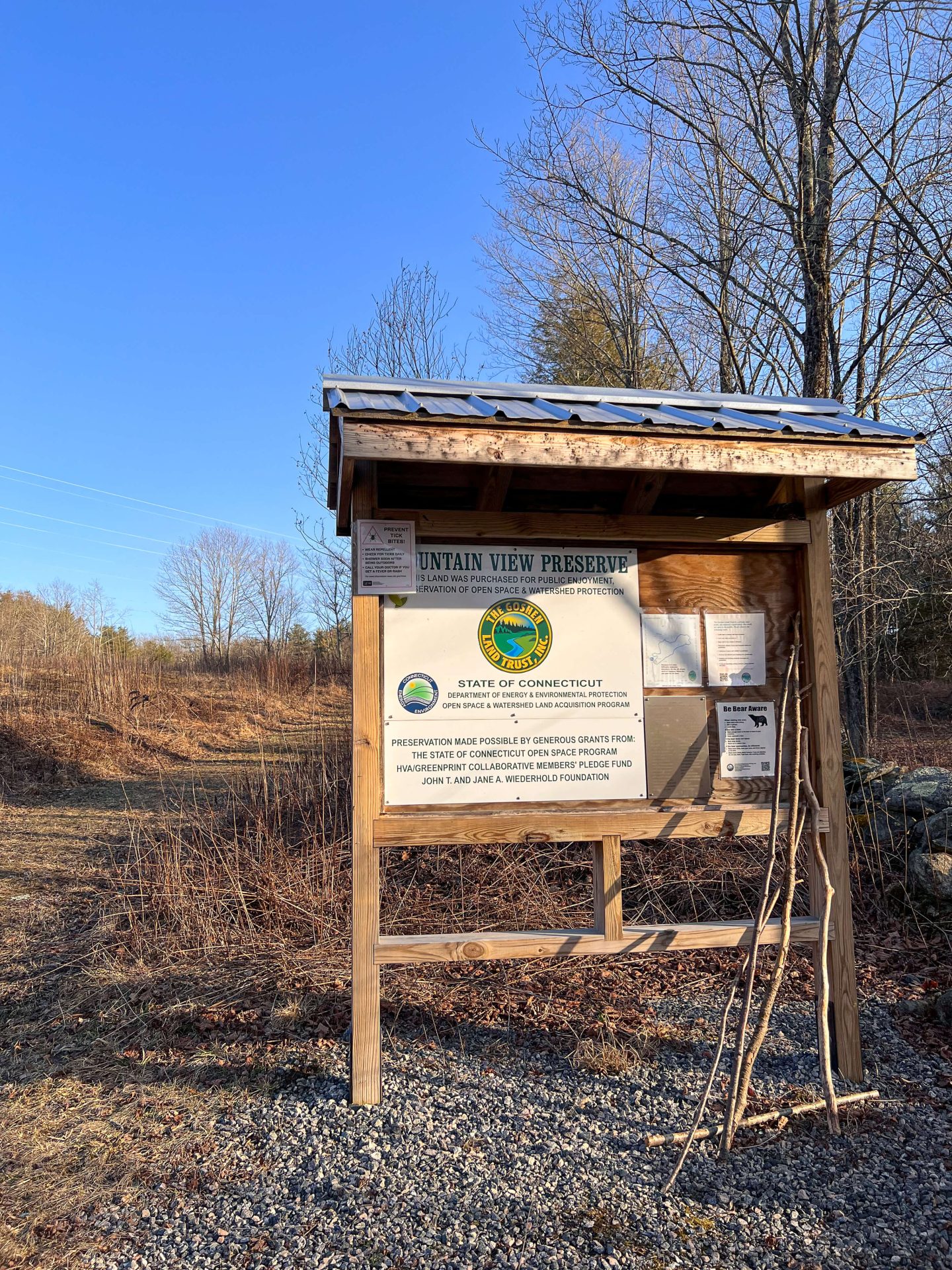 trail sign at goshen land trust hike at sunset time in late fall