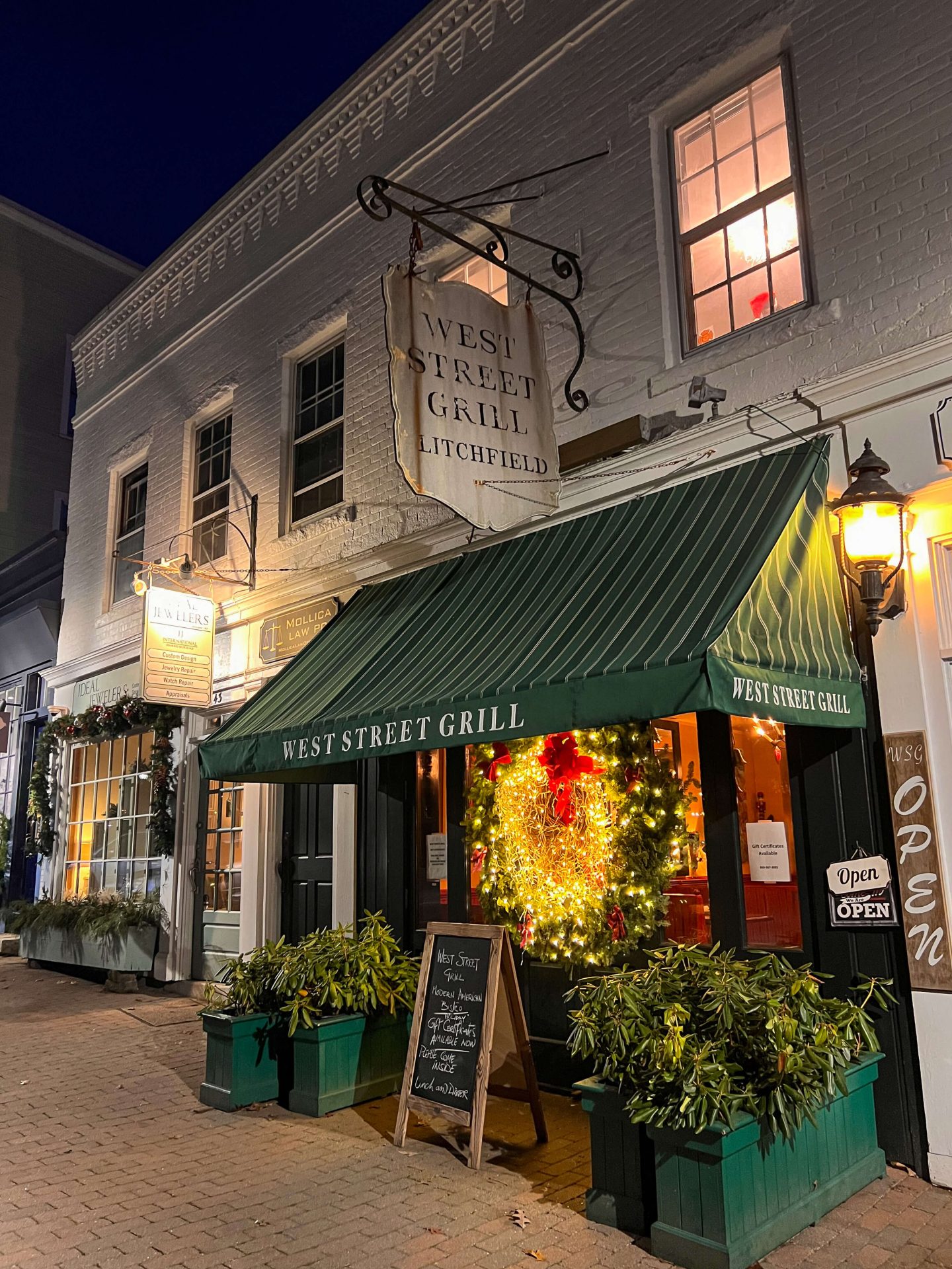downtown main street in litchfield in winter with west street grill decorated for christmas