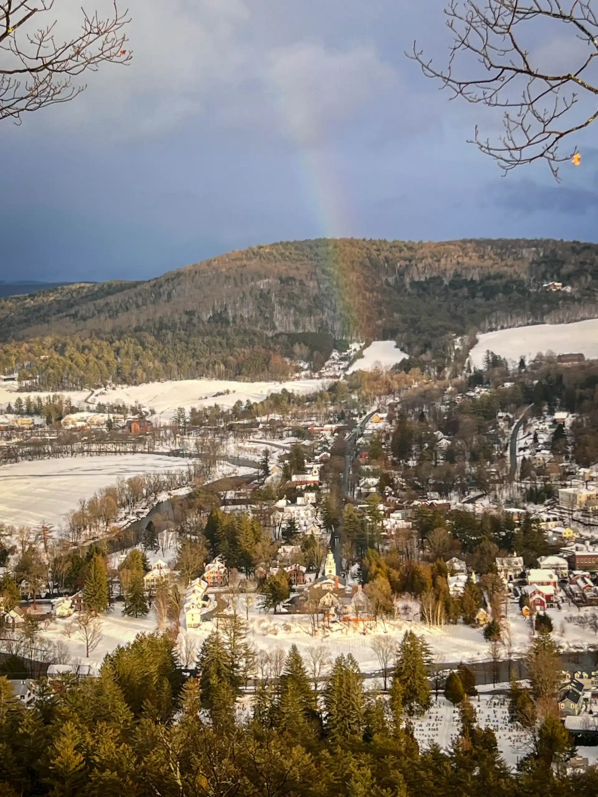 rainbow on snowy mount tom in woodstock vermont.