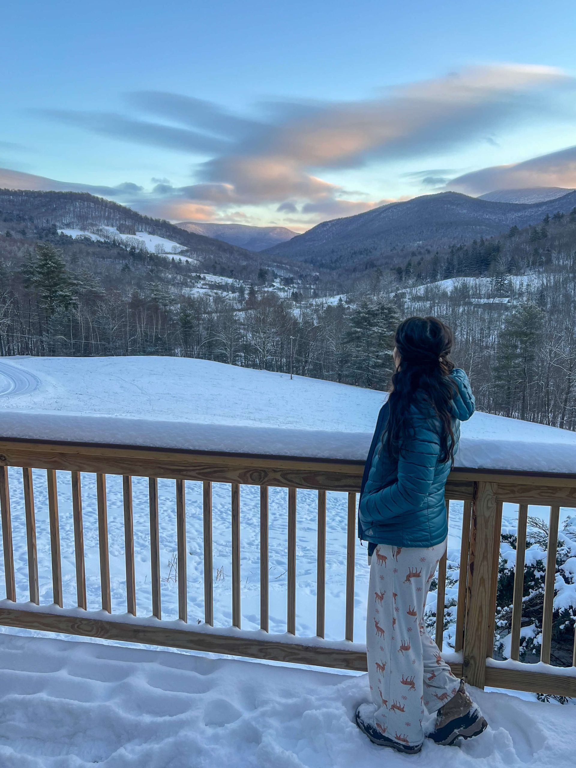 woman on deck of manchester vermont airbnb and VRBO