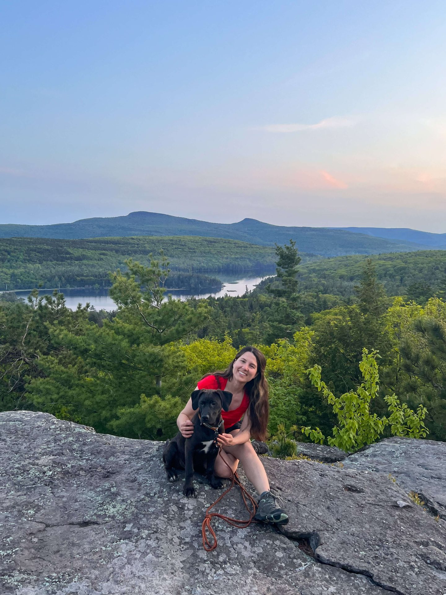 woman and dog on a hike in north south lake campground at sunset