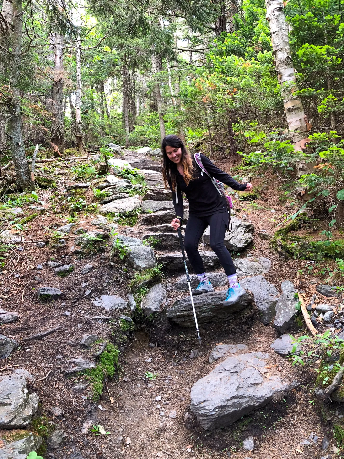 woman hiking down mount abraham in vermont