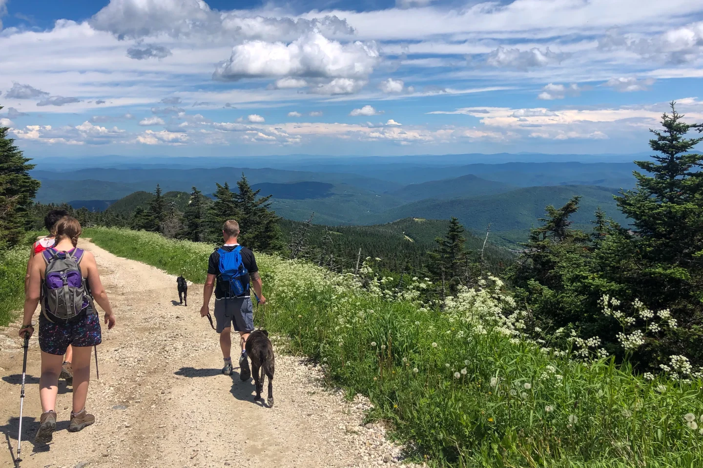 man hiking down killington