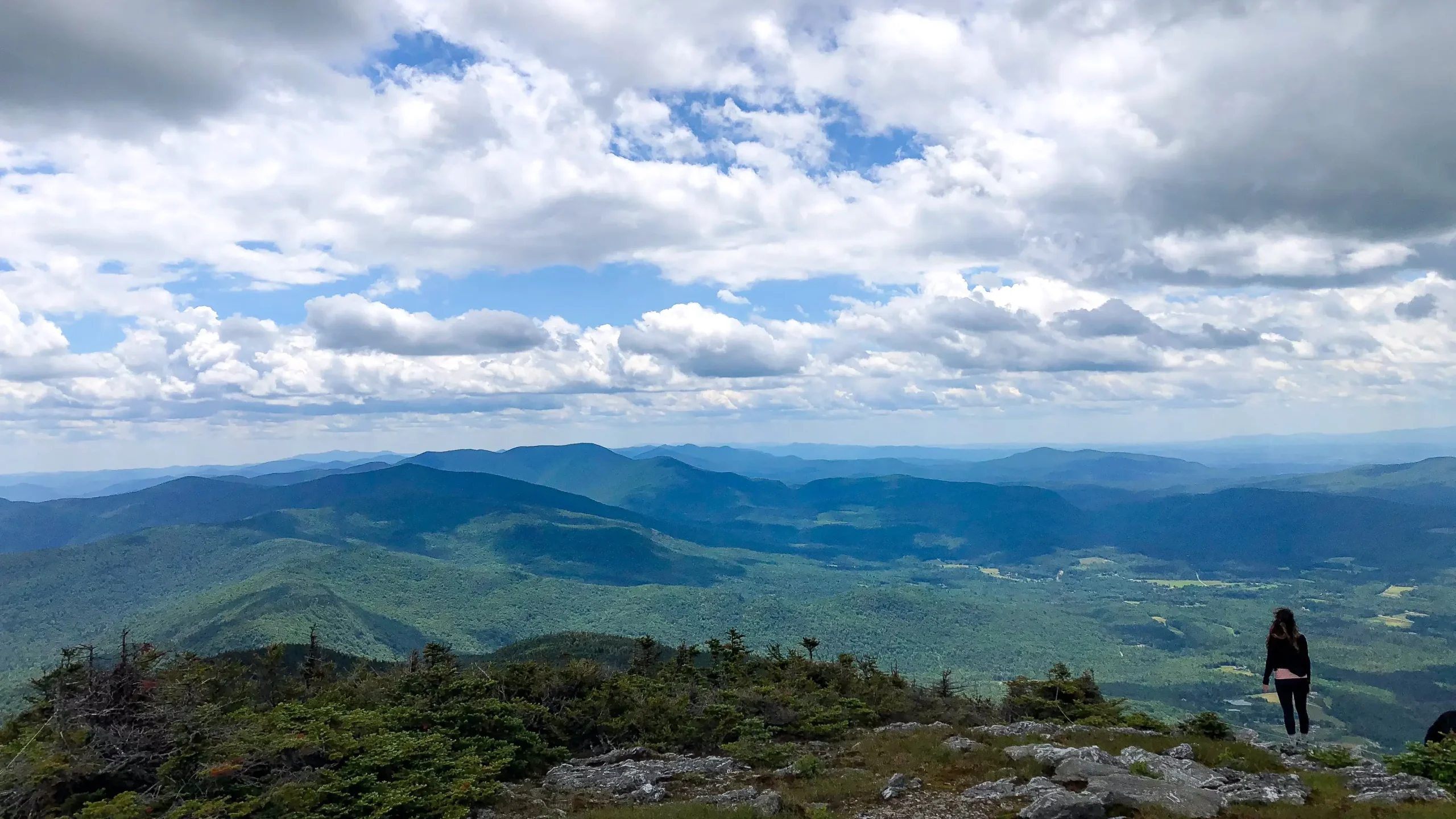 views from mount abraham in vermont with green mountains all around on a summer day