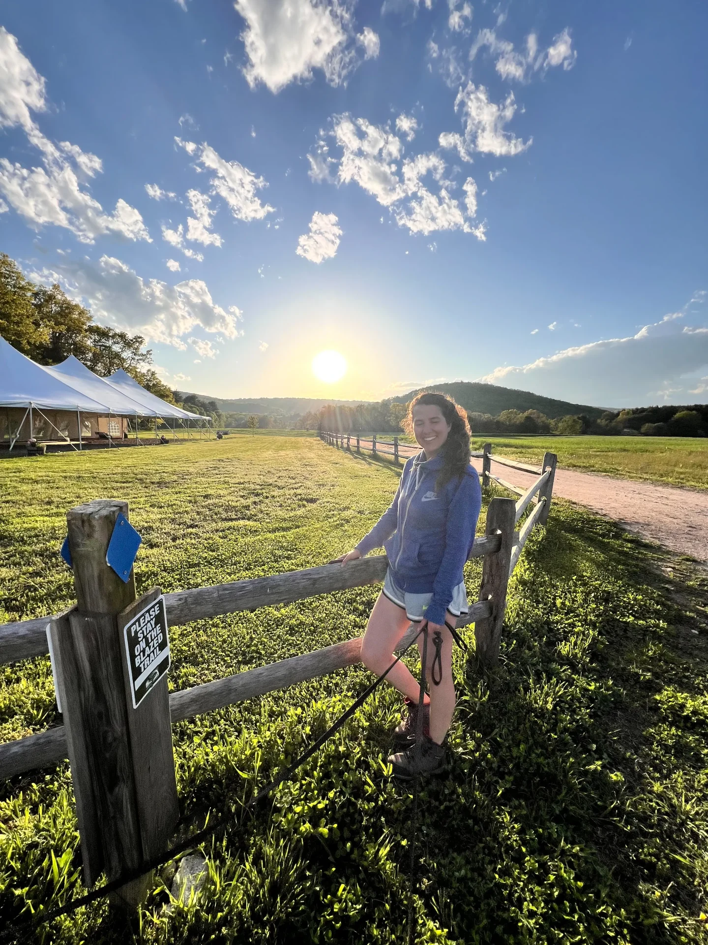 woman smiling at hiking trails at tulmeadow farm in simsbury connecticut