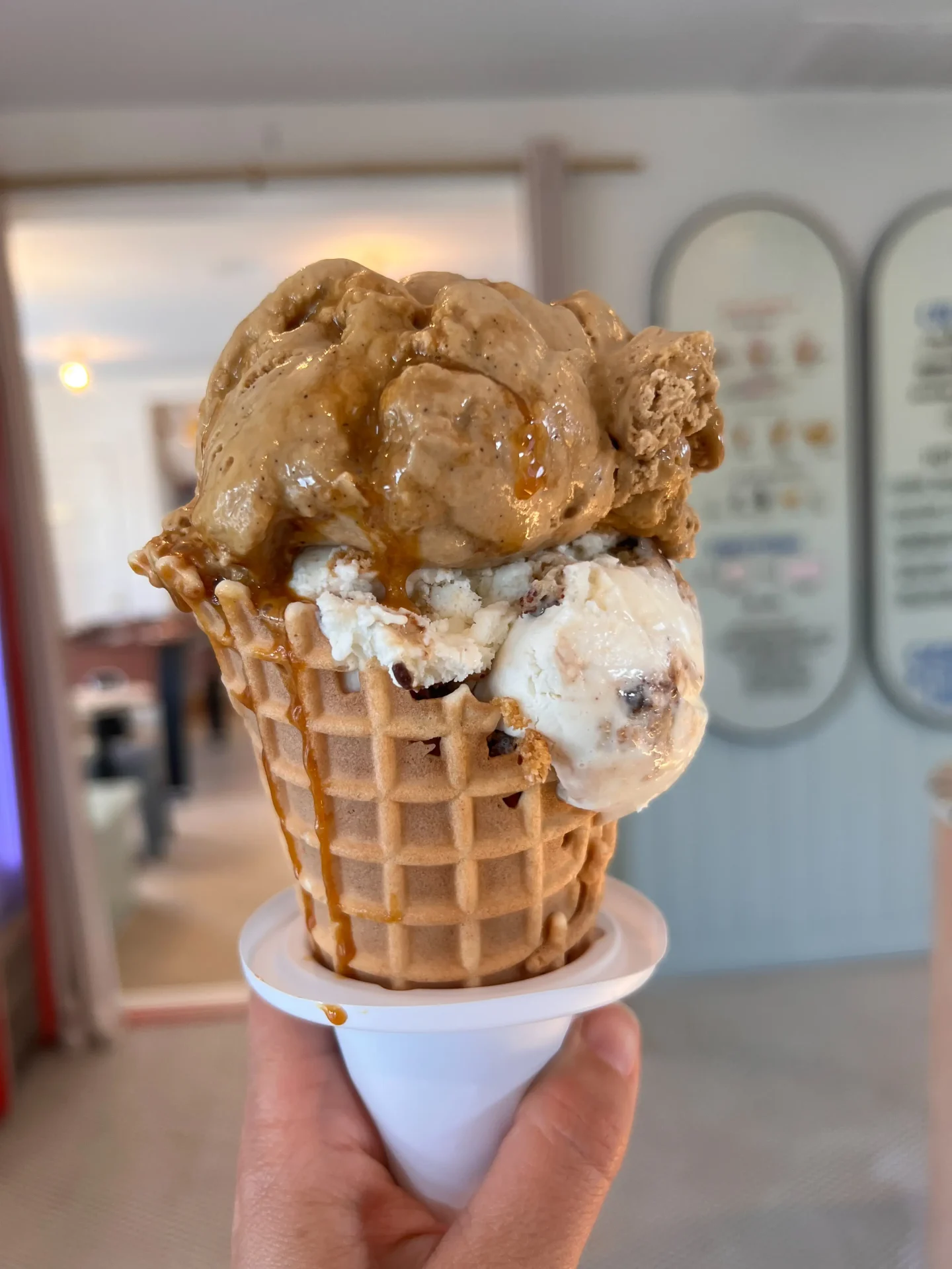 two scoops of ice cream in waffle cone at doms creamery in avon ct