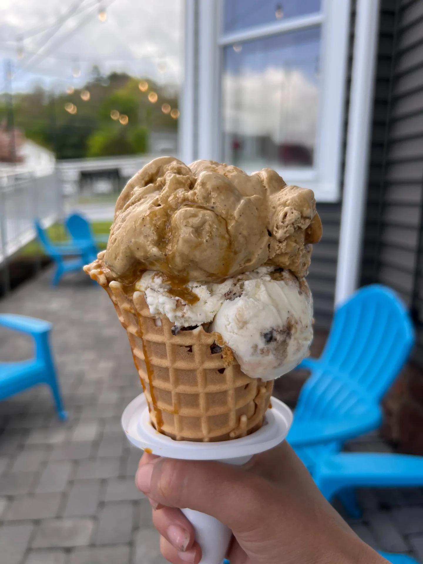 two scoops of ice cream in waffle cone at doms creamery in avon ct