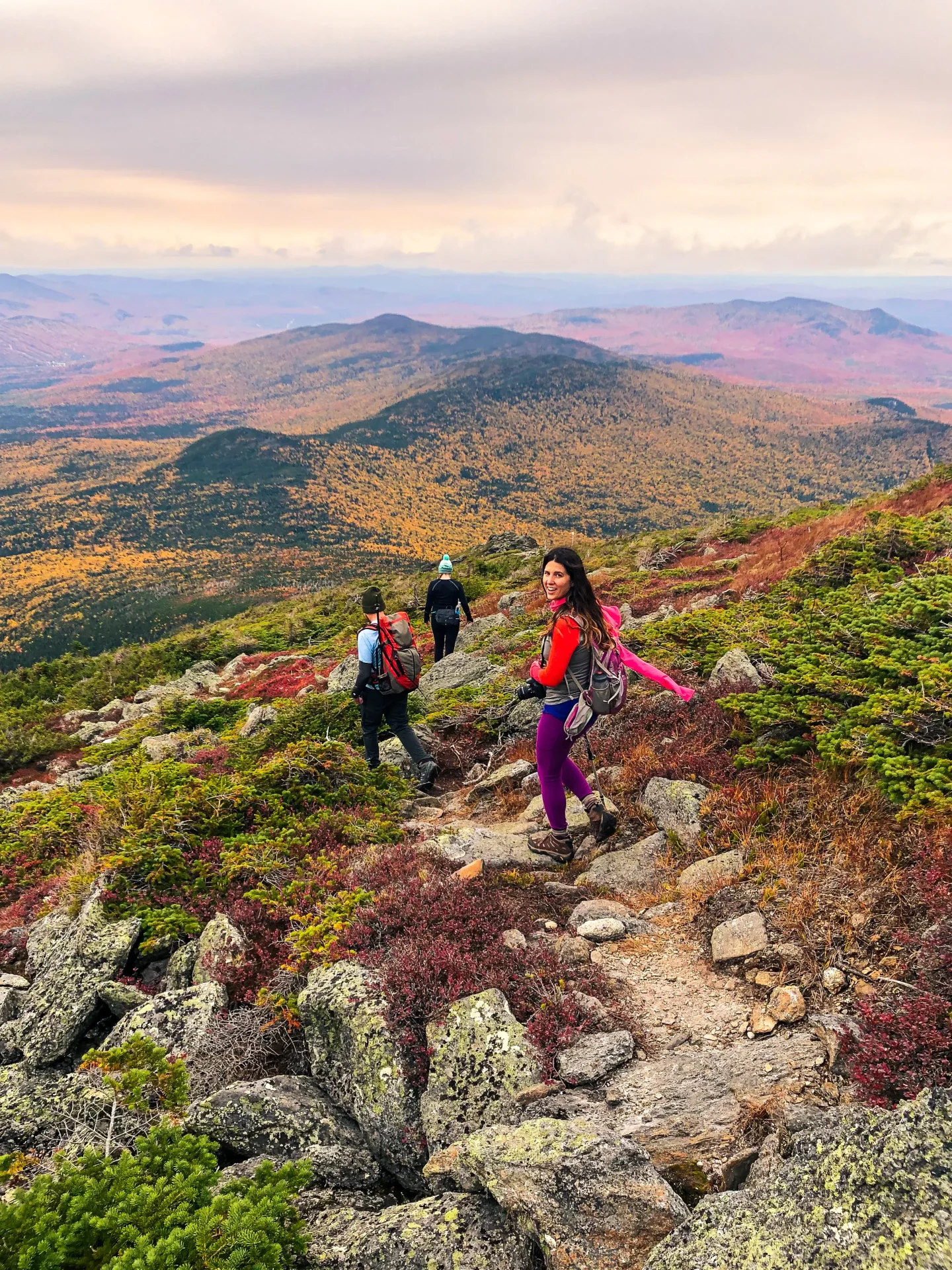 woman on top of Mount Jefferson in new hampshire in fall