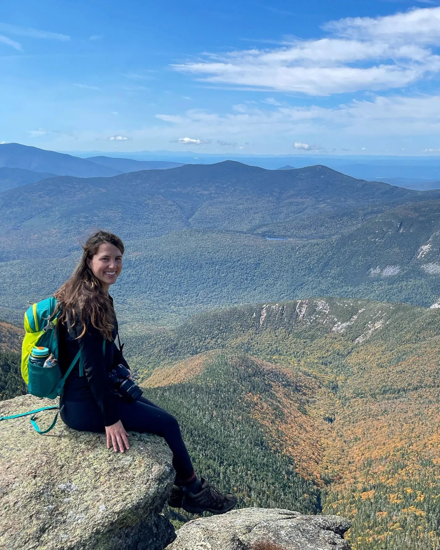 woman on top of most epic hike in new england franconia ridge
