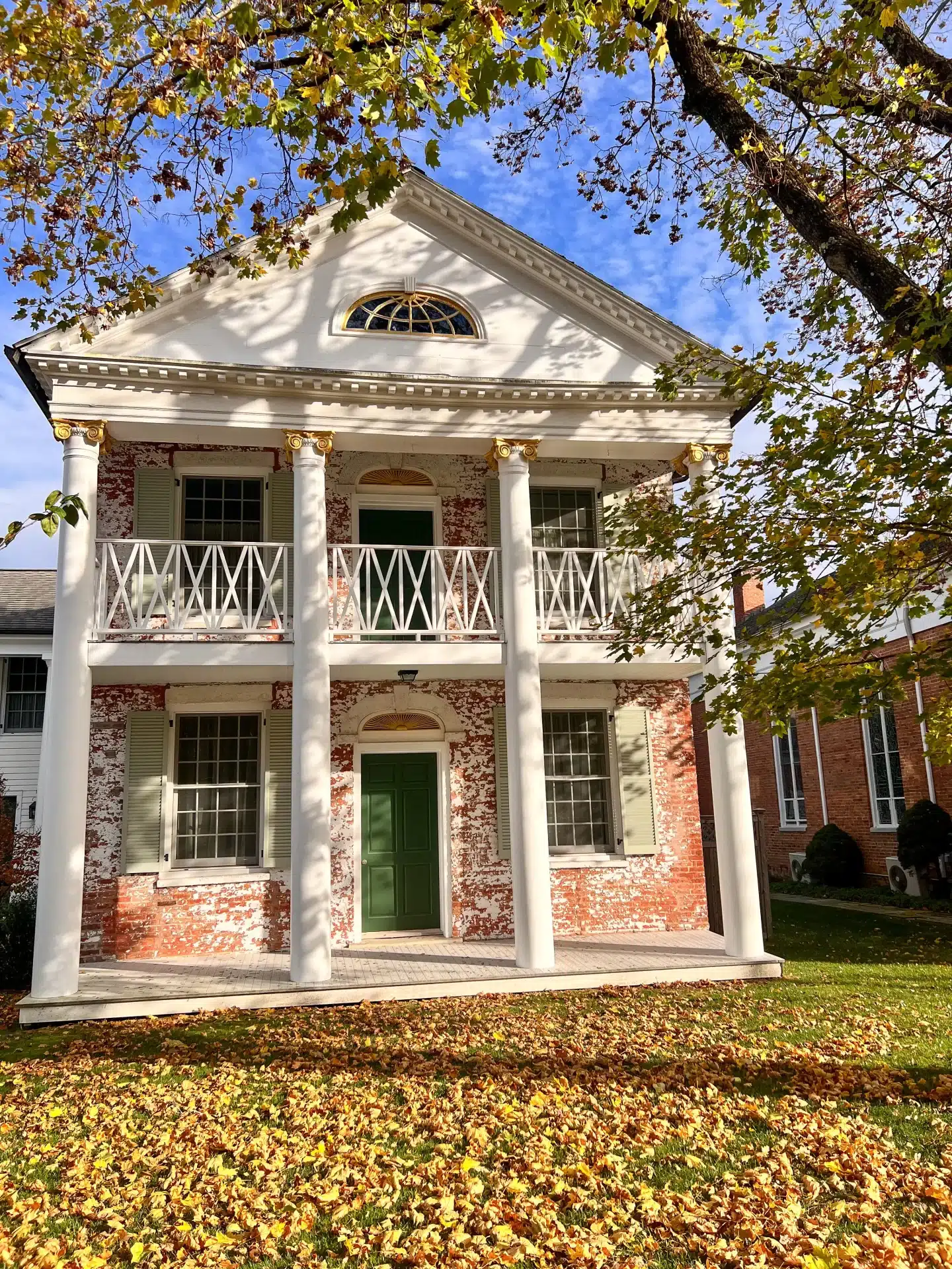 downtown salisbury ct in fall with historic white pillared brick building.