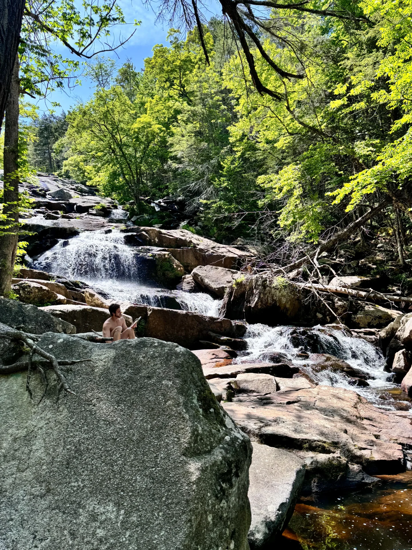 glendale falls in summer surrounded by green leaves in massachusetts