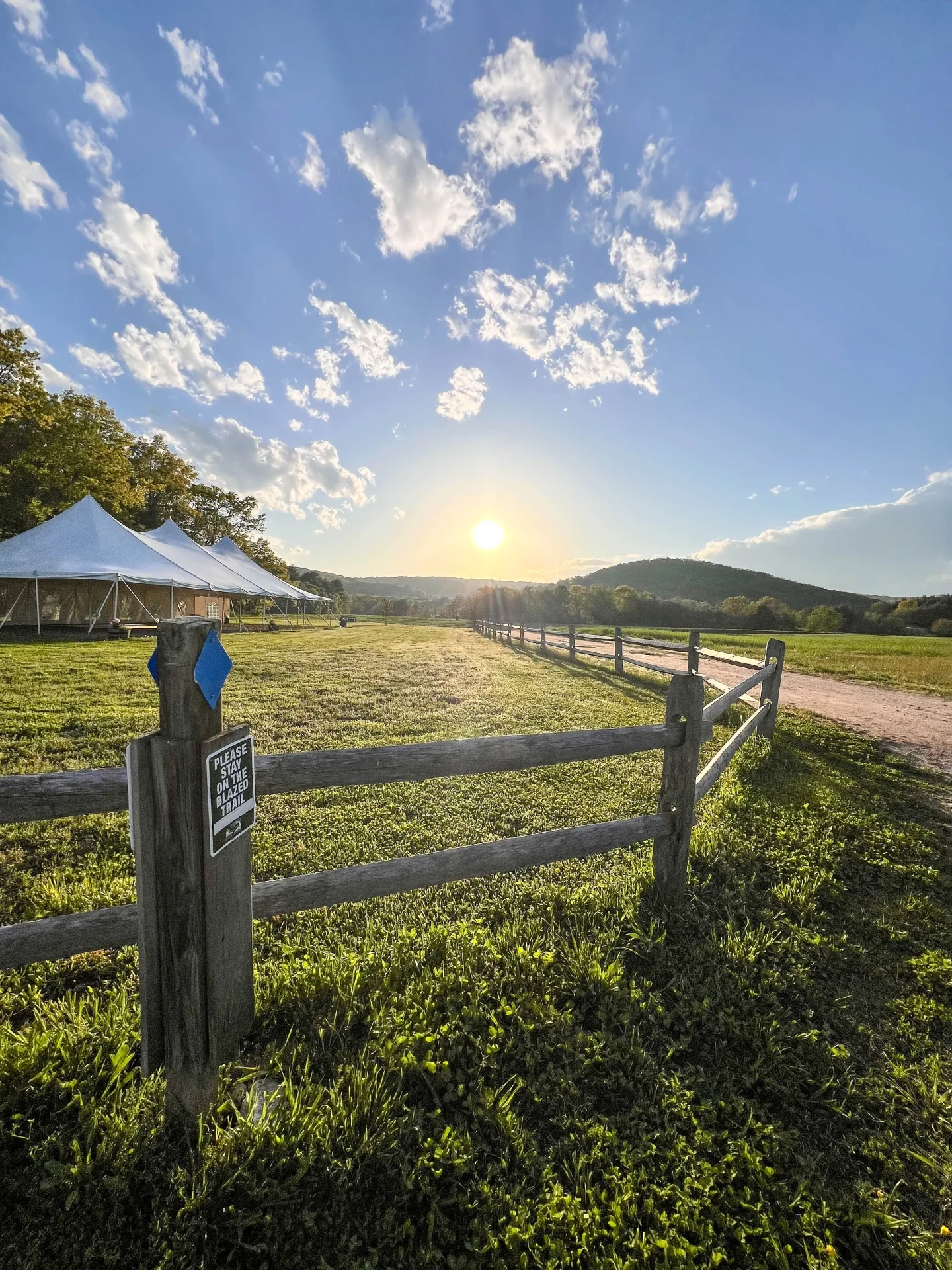 connecticut farm trail with green grass and fences at tulmeadow farm