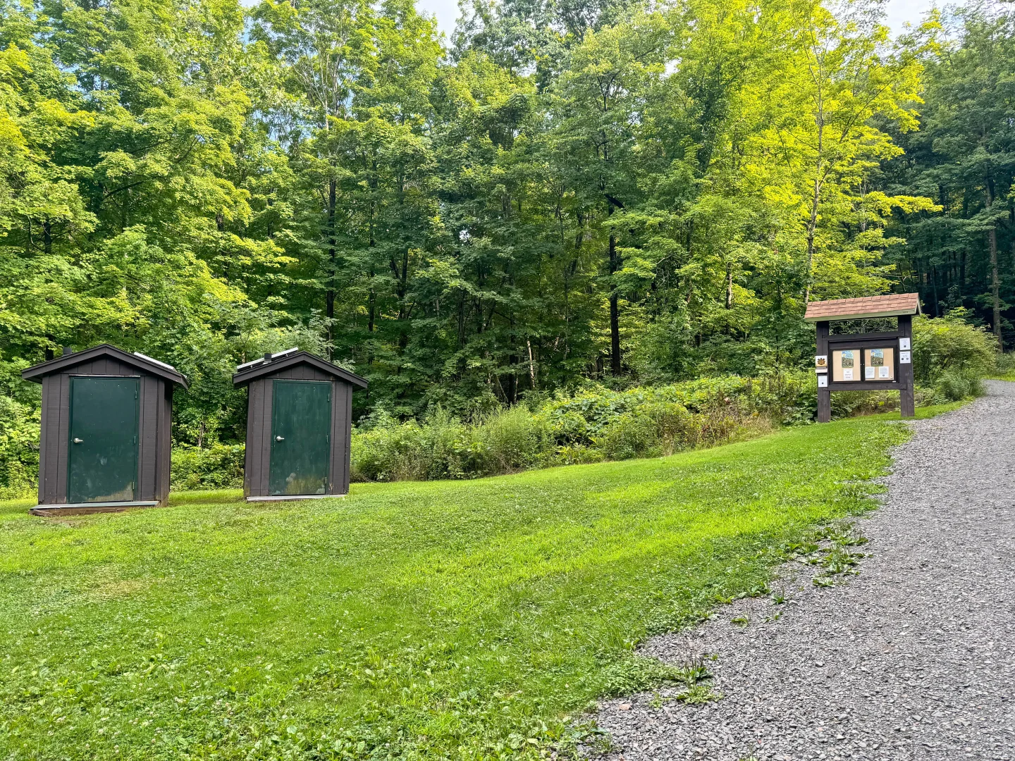 restrooms and trail sign at the start of heublein tower