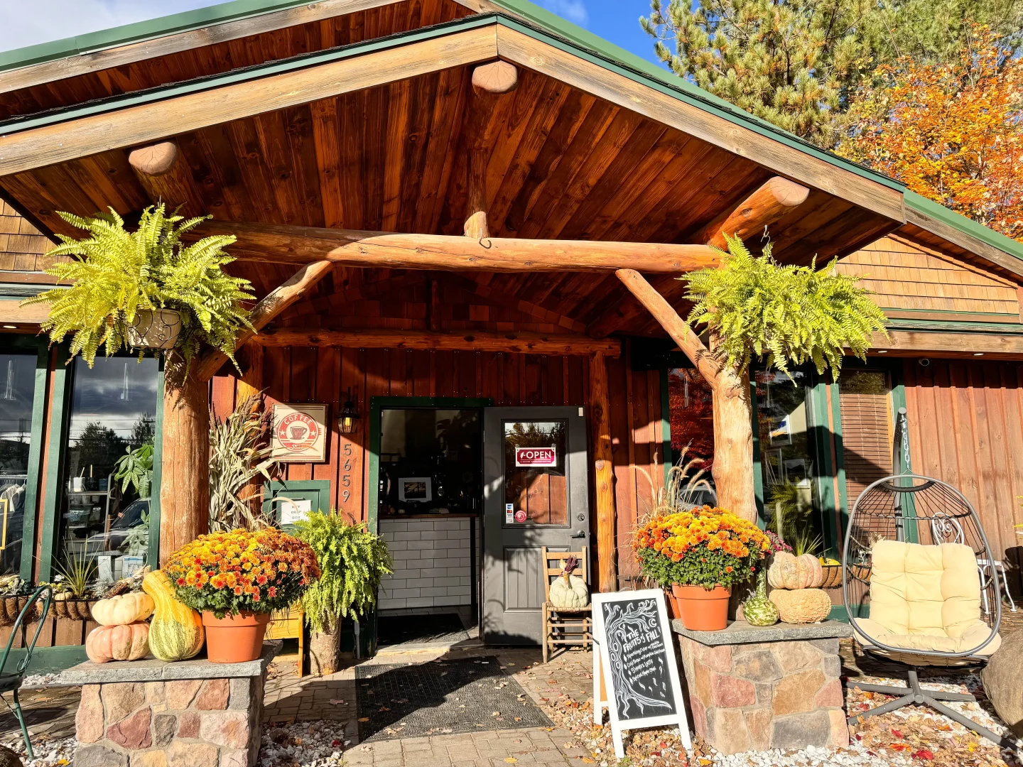 outside of capisce coffee shop on a sunny day in lake placid new york