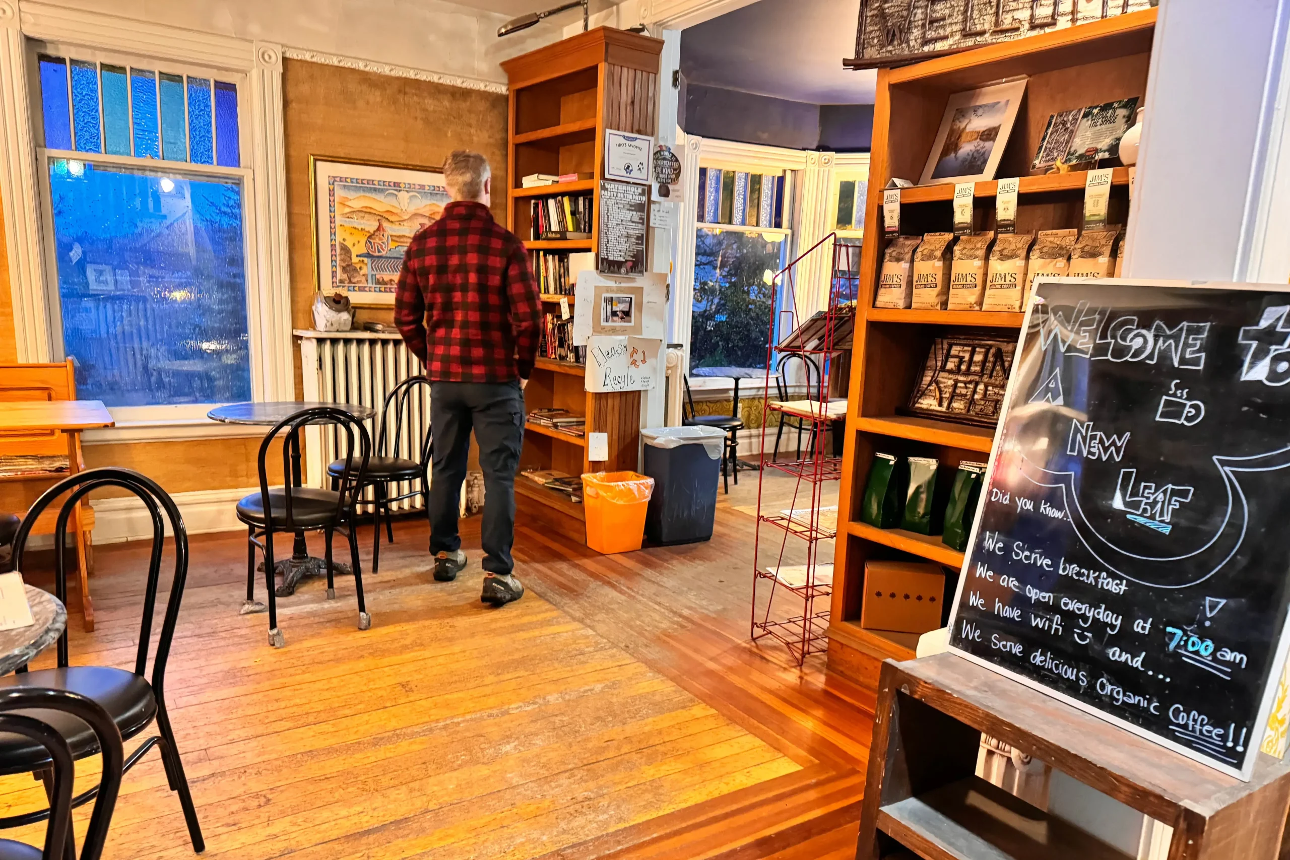 man inside of a new leaf coffee house in downtown lake placid