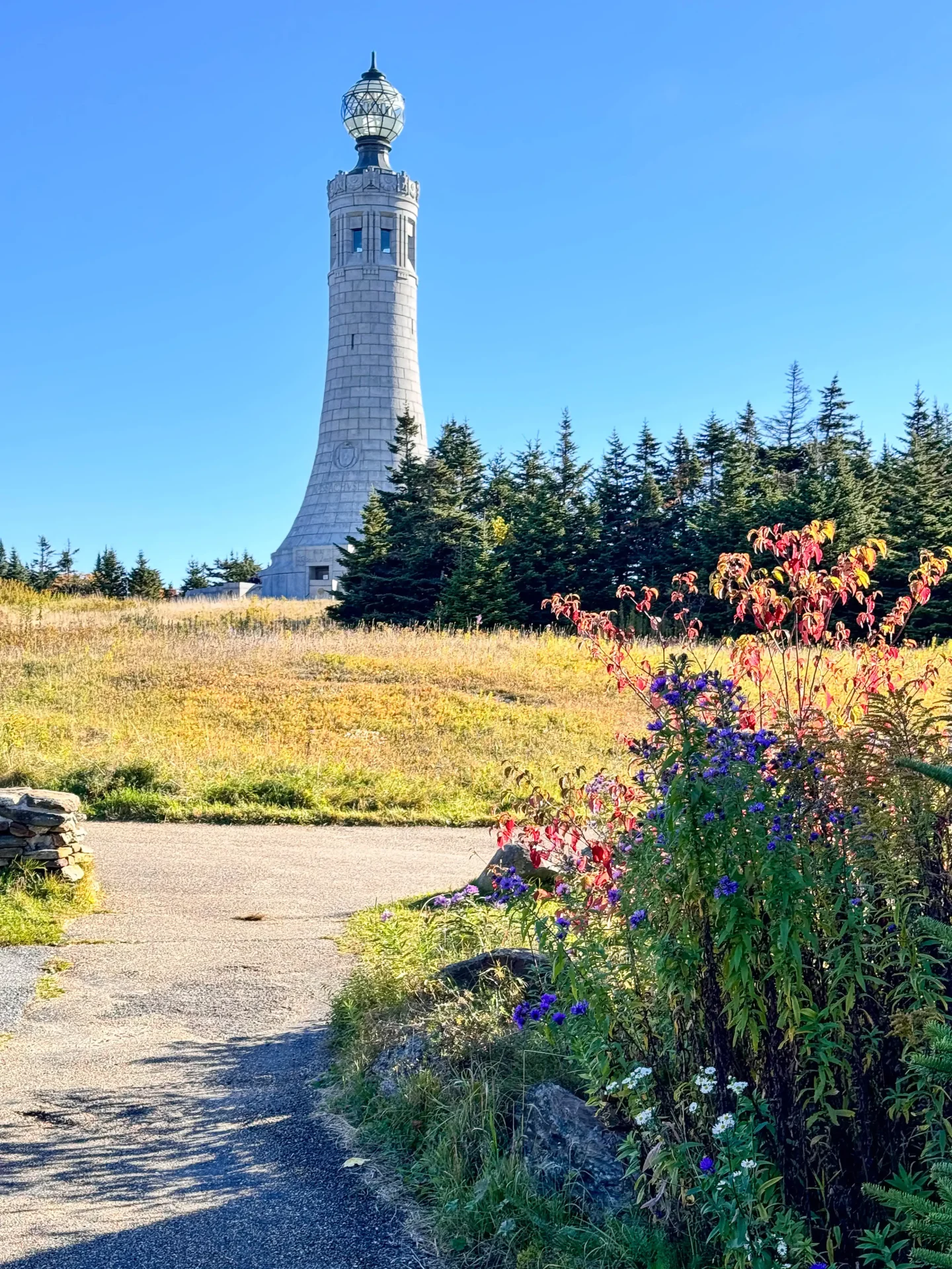 view of stone memorial tower in fall at mount greylock