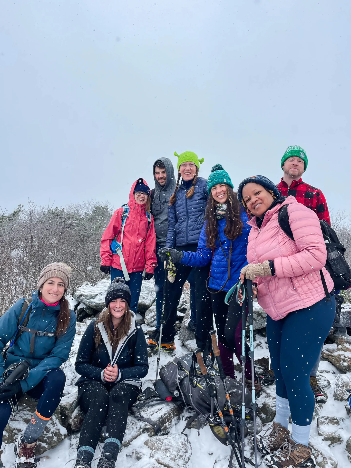 group of hikers on top of bear mountain in connecticut