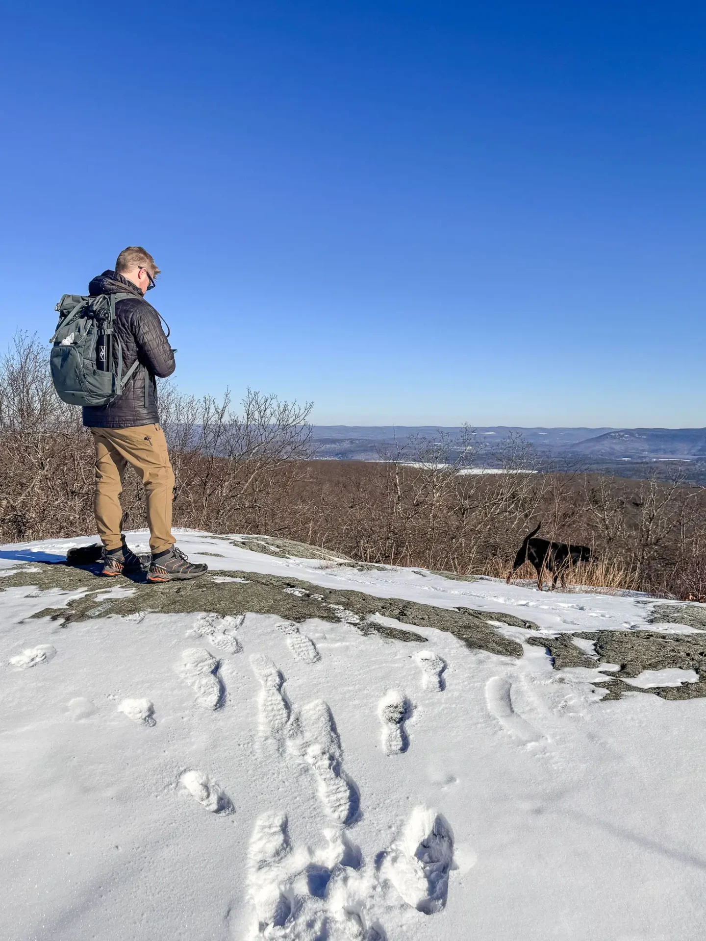 winter view of bare snowy mountains in connecticut with blue skies in salisbury