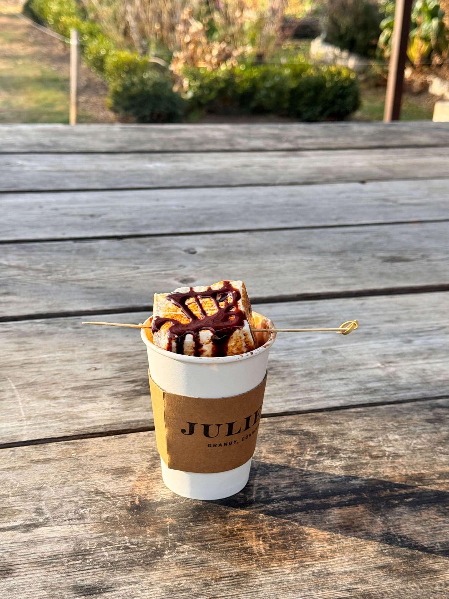 hot chocolate at juliens cafe in granby connecticut with homemade marshmallow on top and chocolate drizzle