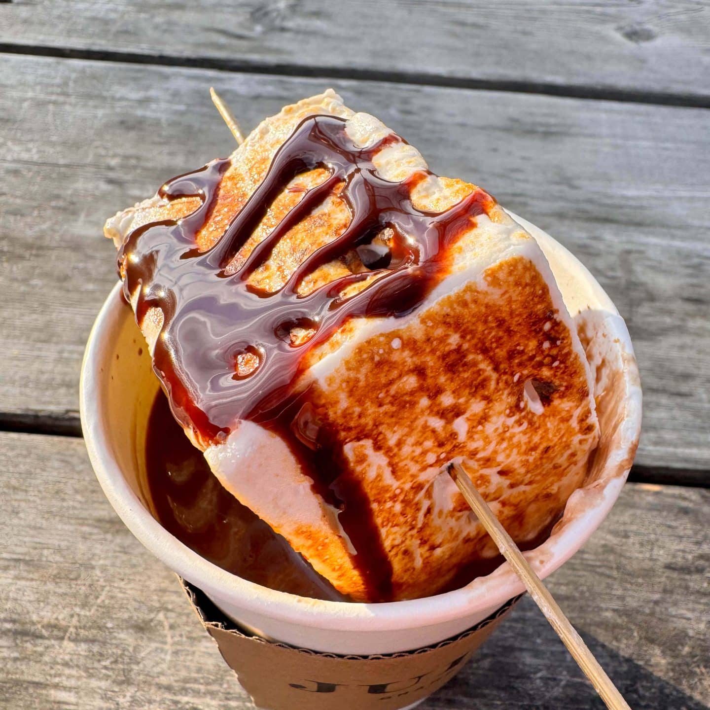 hot chocolate at juliens cafe in granby connecticut with homemade marshmallow on top and chocolate drizzle