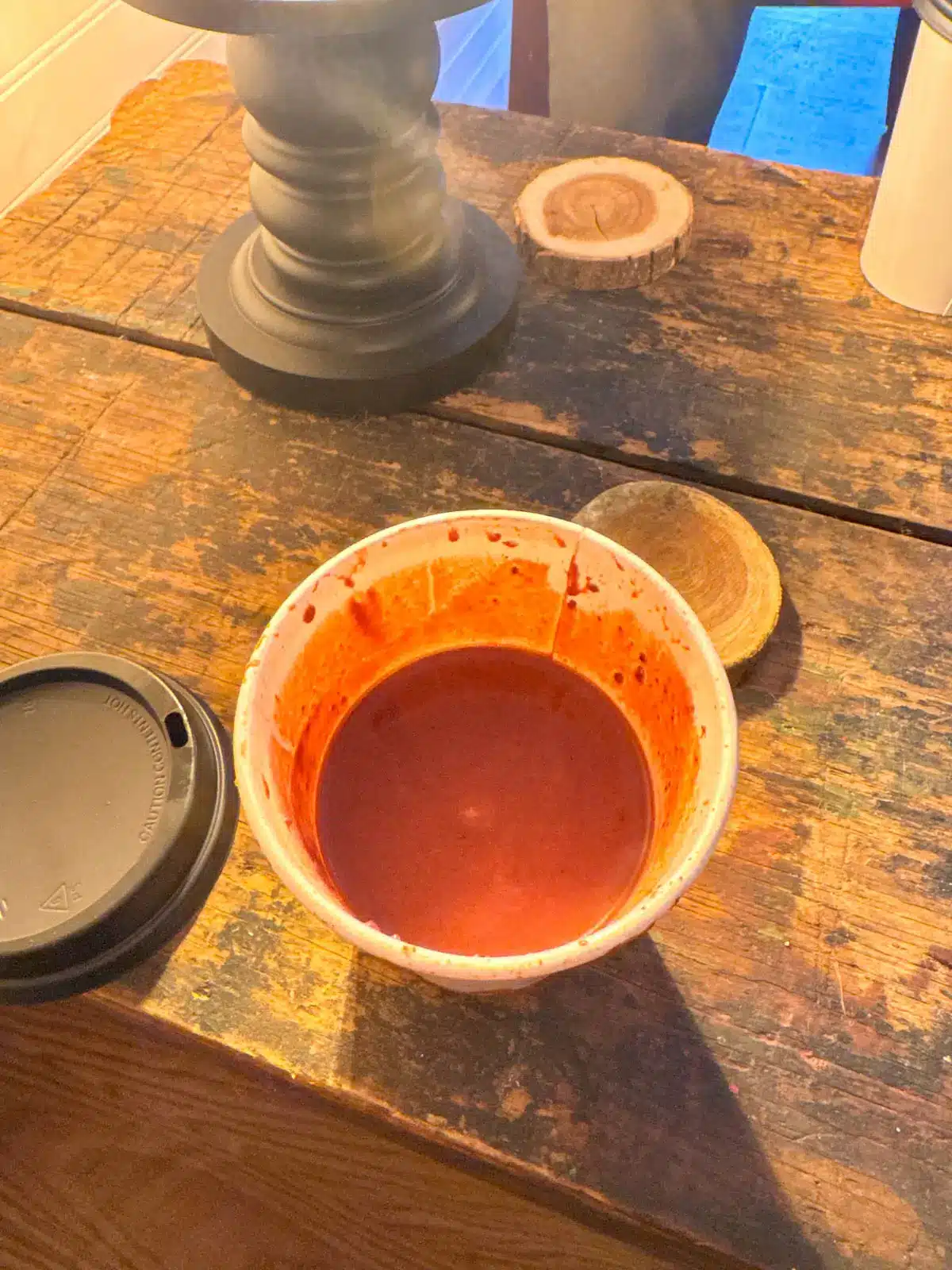 white cup filled with dark hot chocolate.