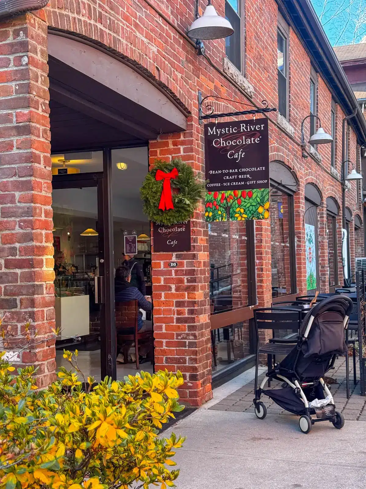 brick building of mystic river chocolate cafe in downtown mystic connecticut.