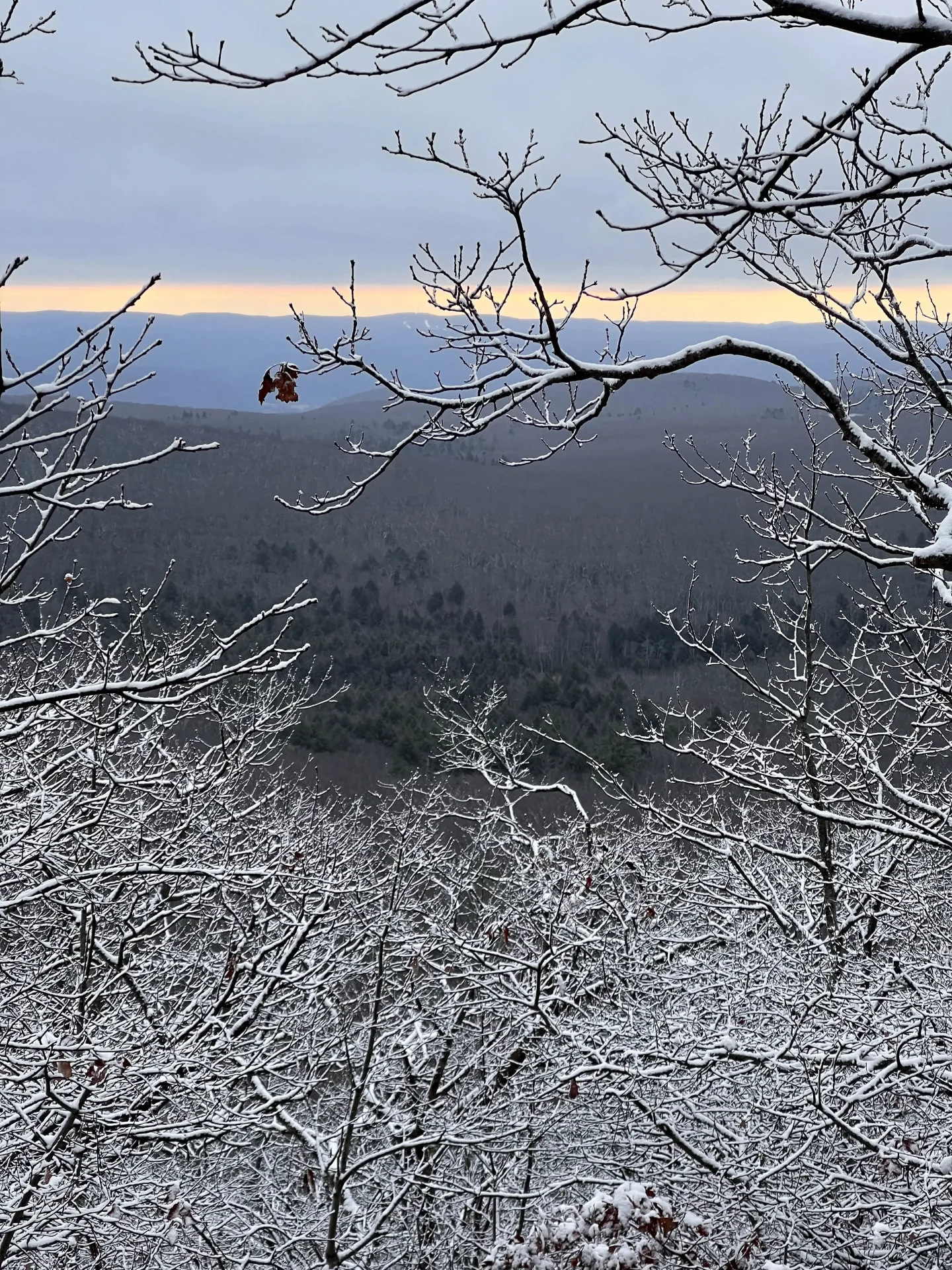 hiking up to bear mountain in winter in connecticut