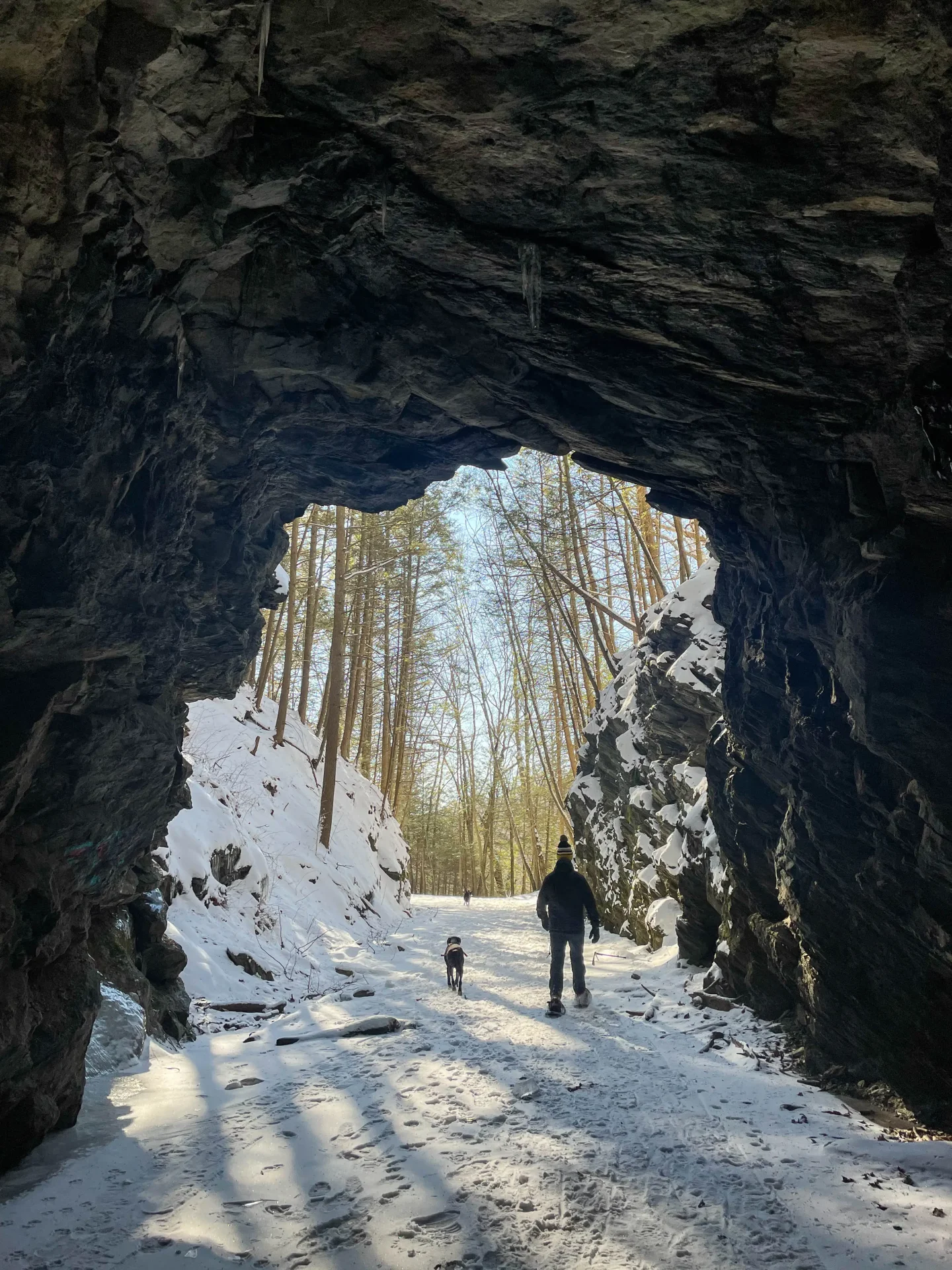 steep rock tunnel in winter in connecticut with snow on ground