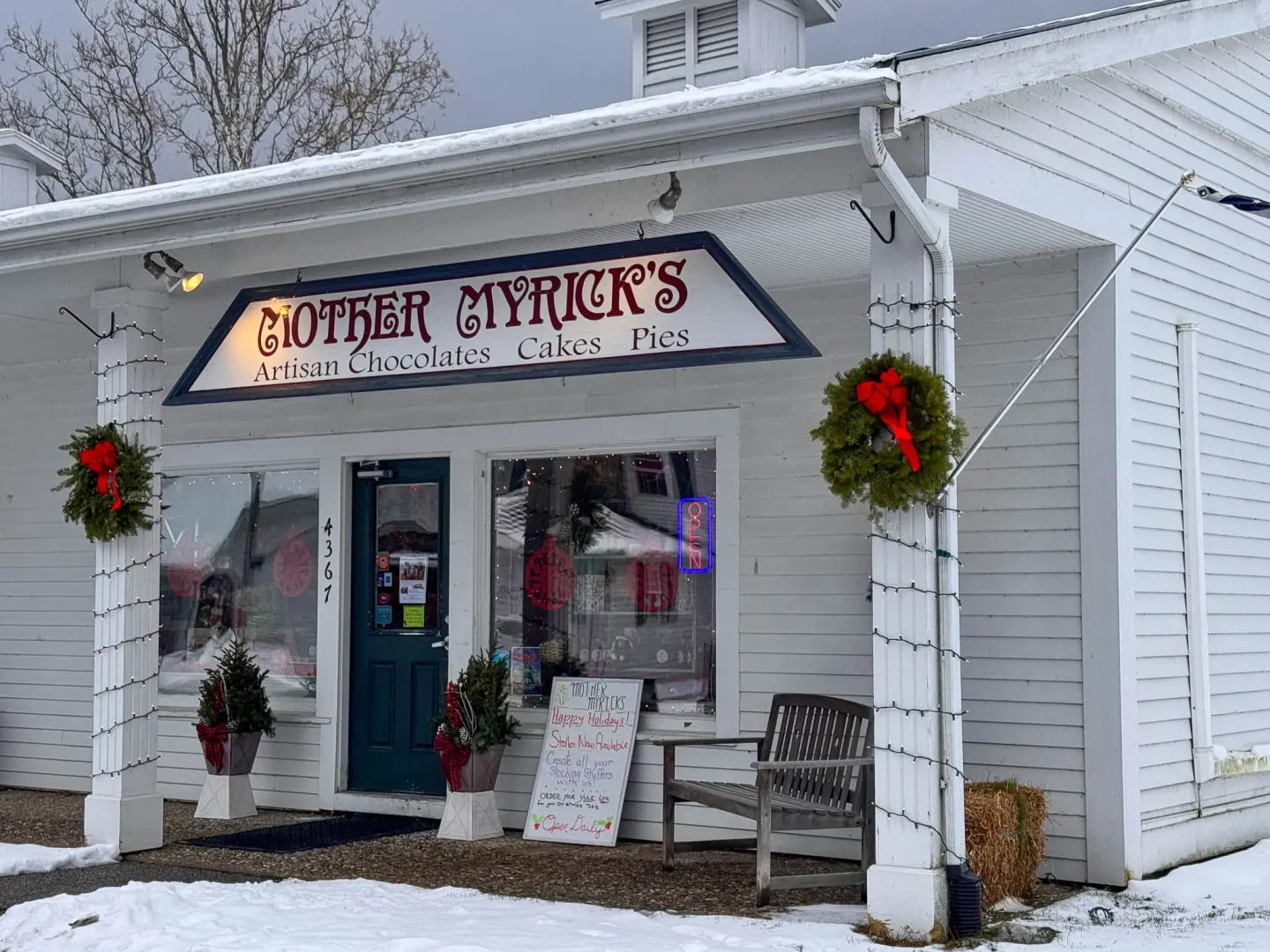 chocolate shop in manchester vermont in winter with holiday wreath