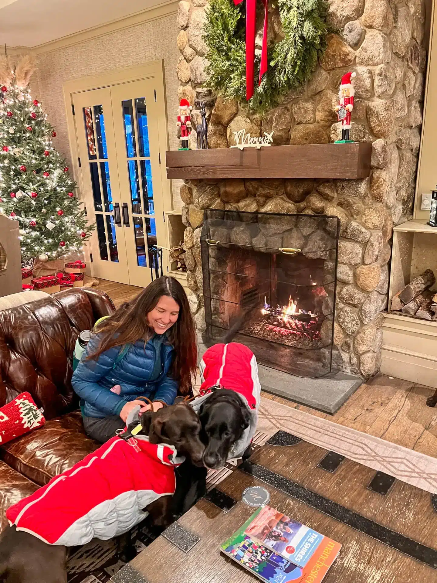 woman and dogs at dog friendly kimpton taconic hotel in manchester vermont