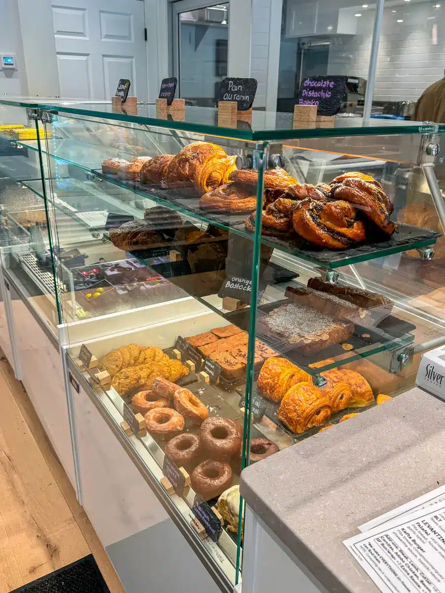 variety of pastries in a glass case at cornwall market in connecticut