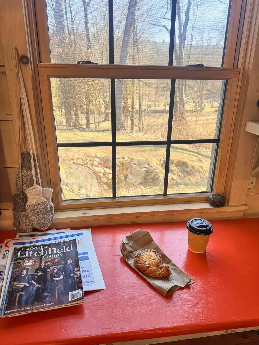 croissant on a paper bag in front of a window in cornwall c