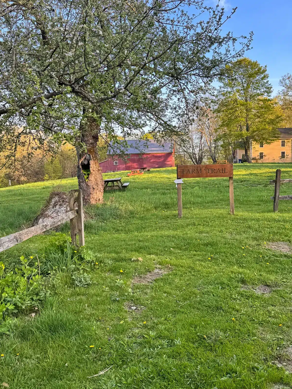 entrance to flanders nature center in connecticut with green grass.