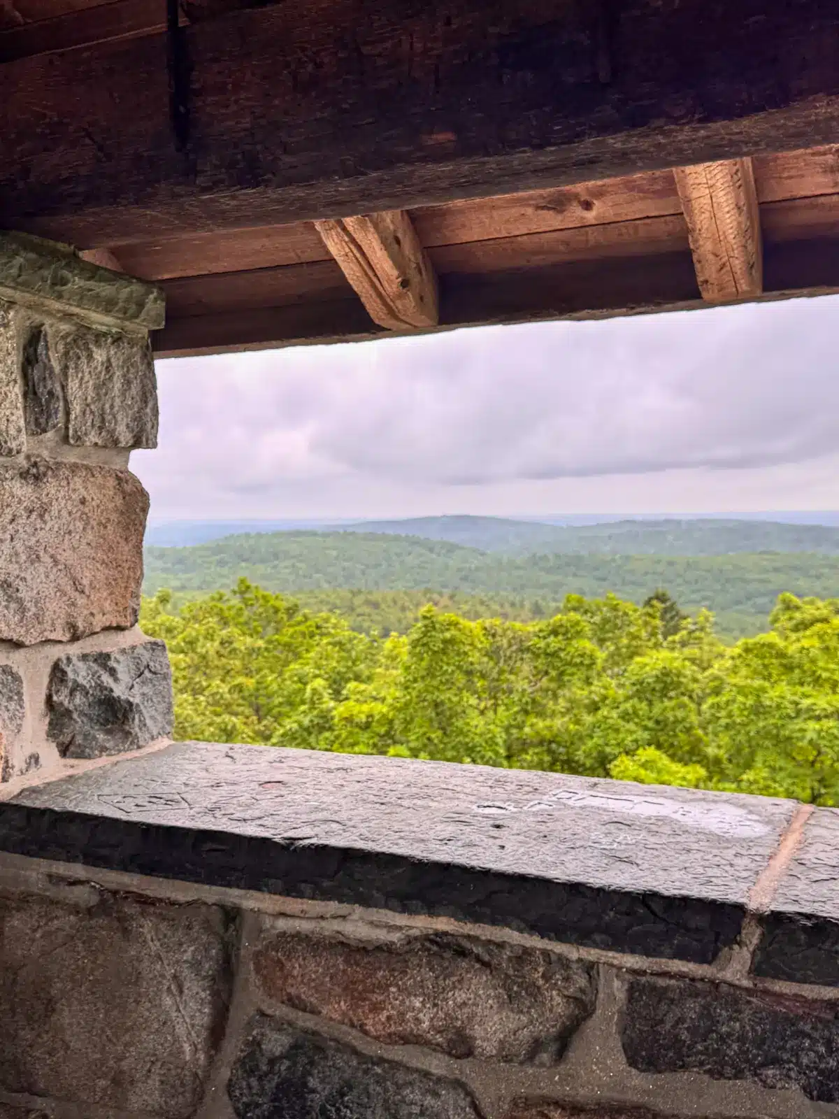 window view of green rolling hills at eliot tower in massachusetts.