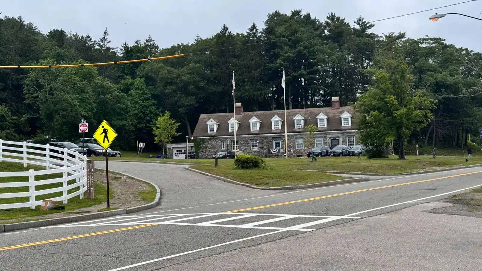street leading to skyline trail with the Massachusetts State Police building in the distance.