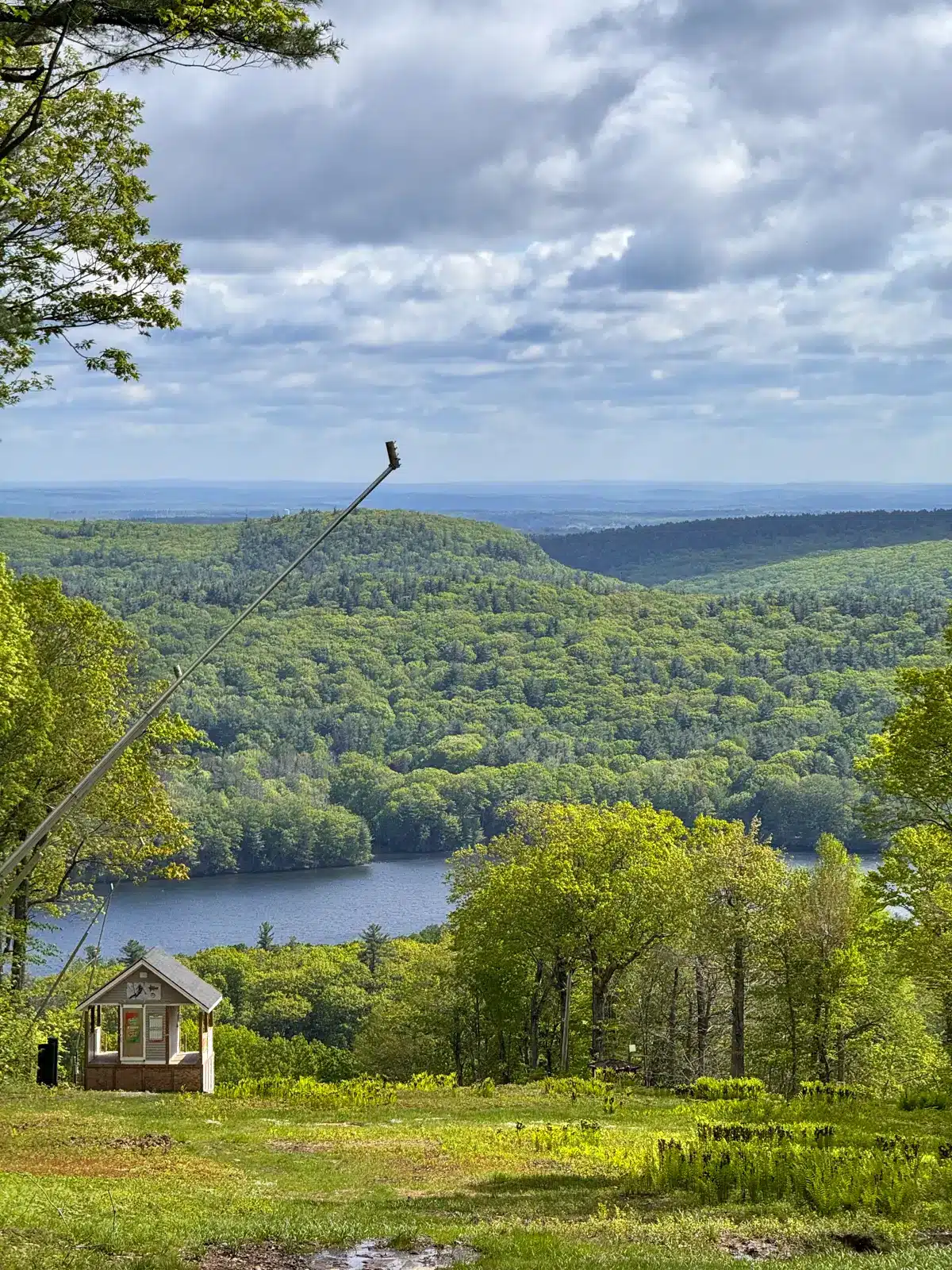 view of ski lift in spring along a loop trail at mount wachusett.