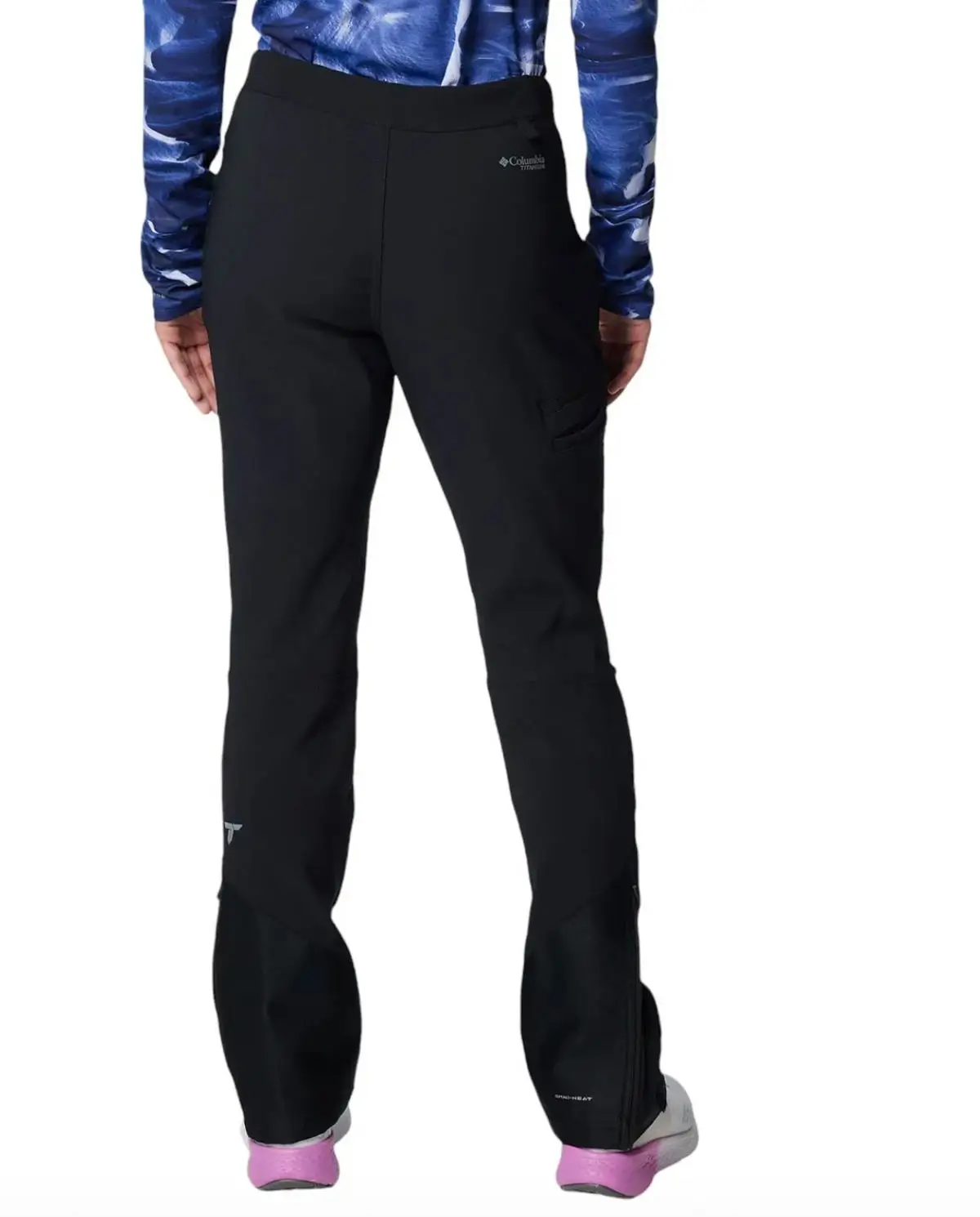 back of woman wearing the columbia omni heat winter hiking pants in black.