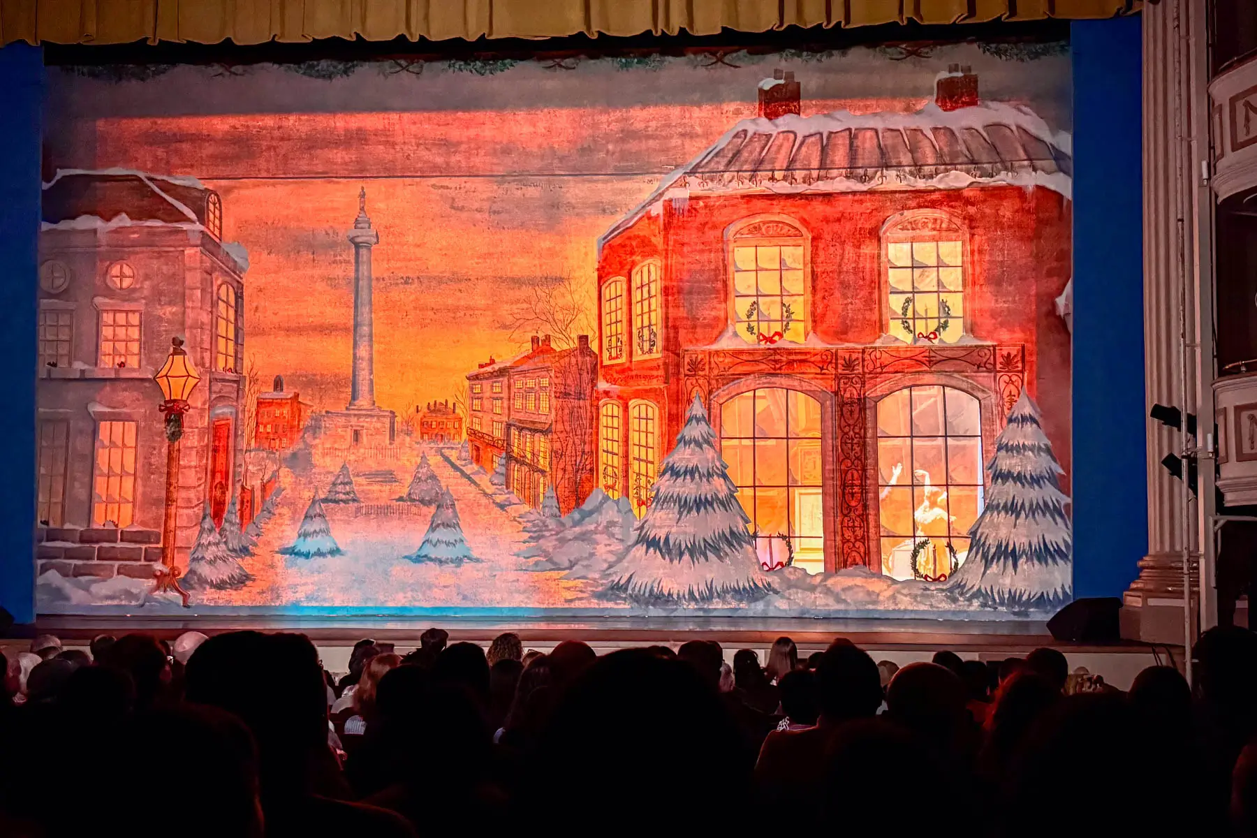 inside shubert theater in winter time with a winter scene on stage.